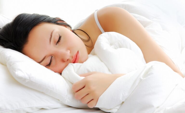 women need to sleep more - woman sleeping